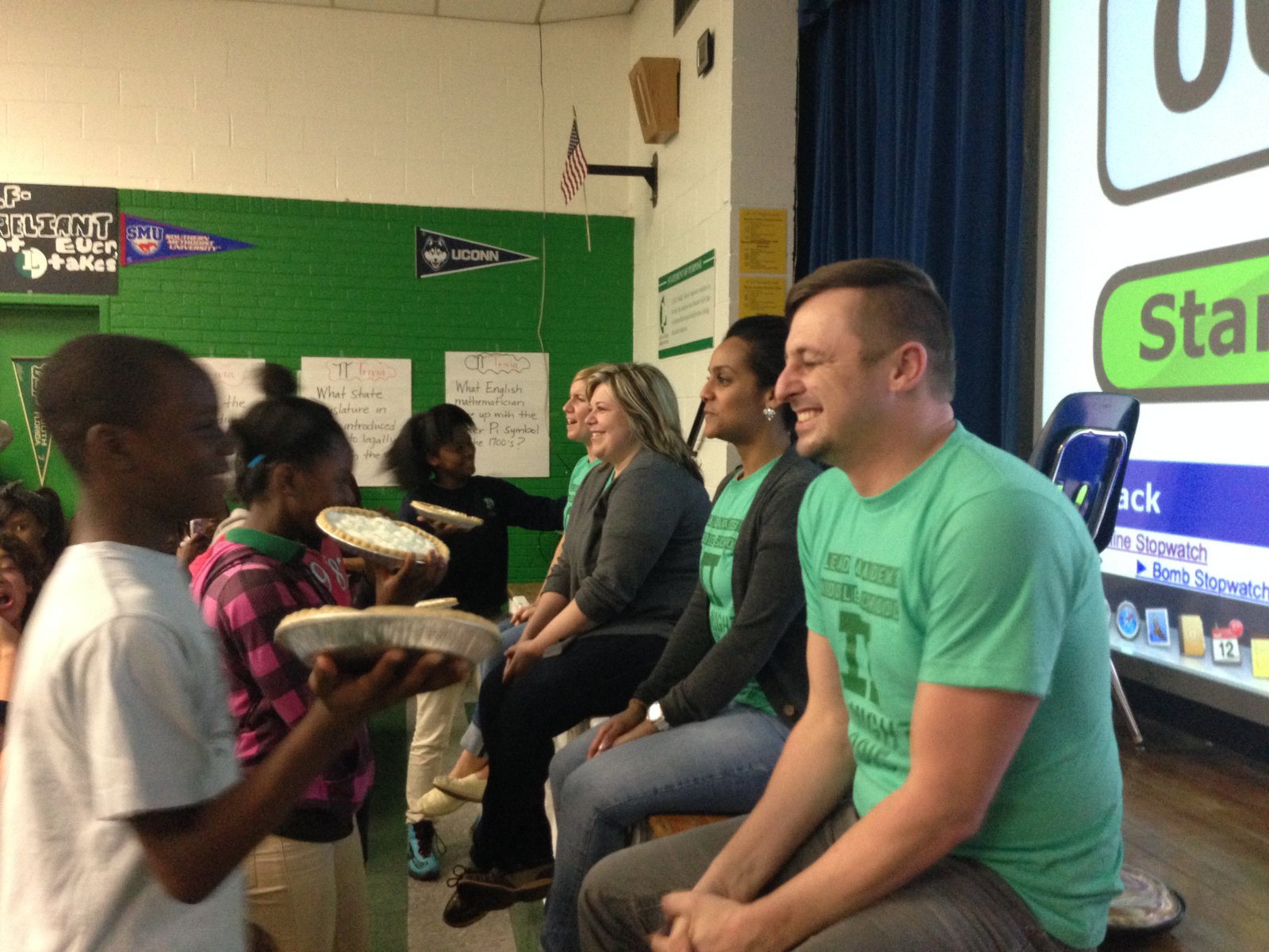 Adam Holdren celebrating with students during a school event