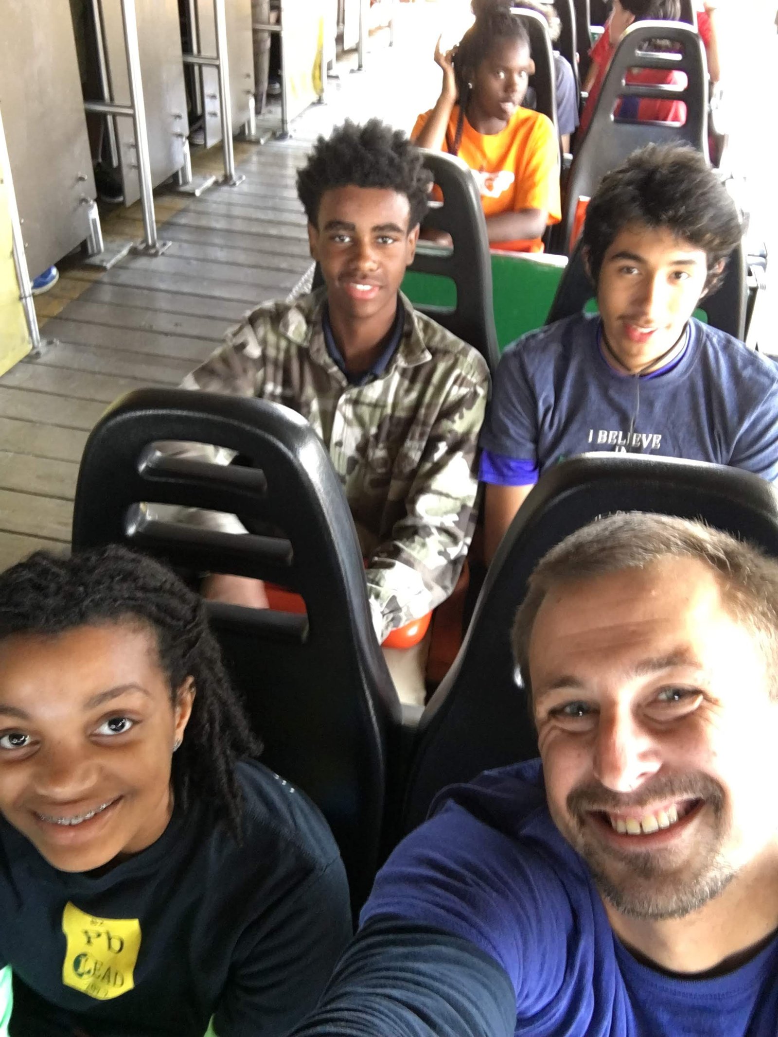 Adam Holdren with students during a school trip